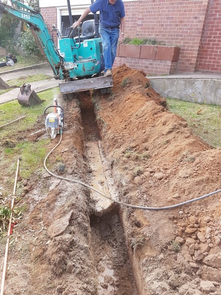 Mini-excavator trenching by Luke Taylor Plumbing