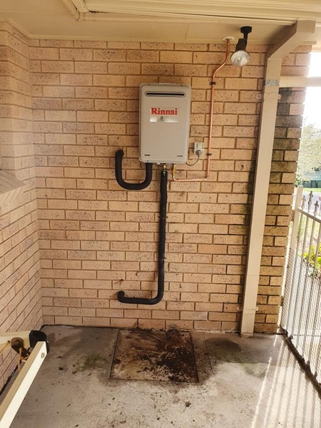 Plumbing pipework on a brick wall by Luke Taylor Plumbing